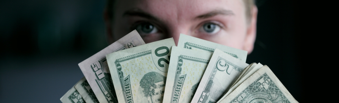 woman holding banknotes