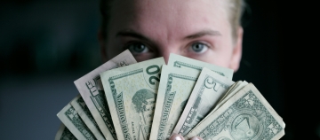 woman holding banknotes