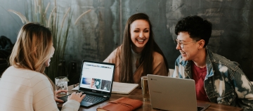millenials seated at table