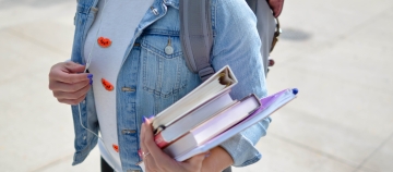 girl with books in hand 